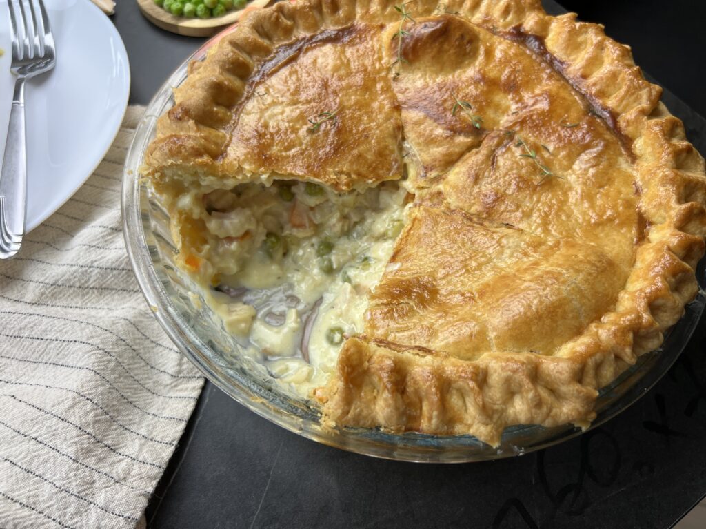 homemade chicken pot pie serving on table